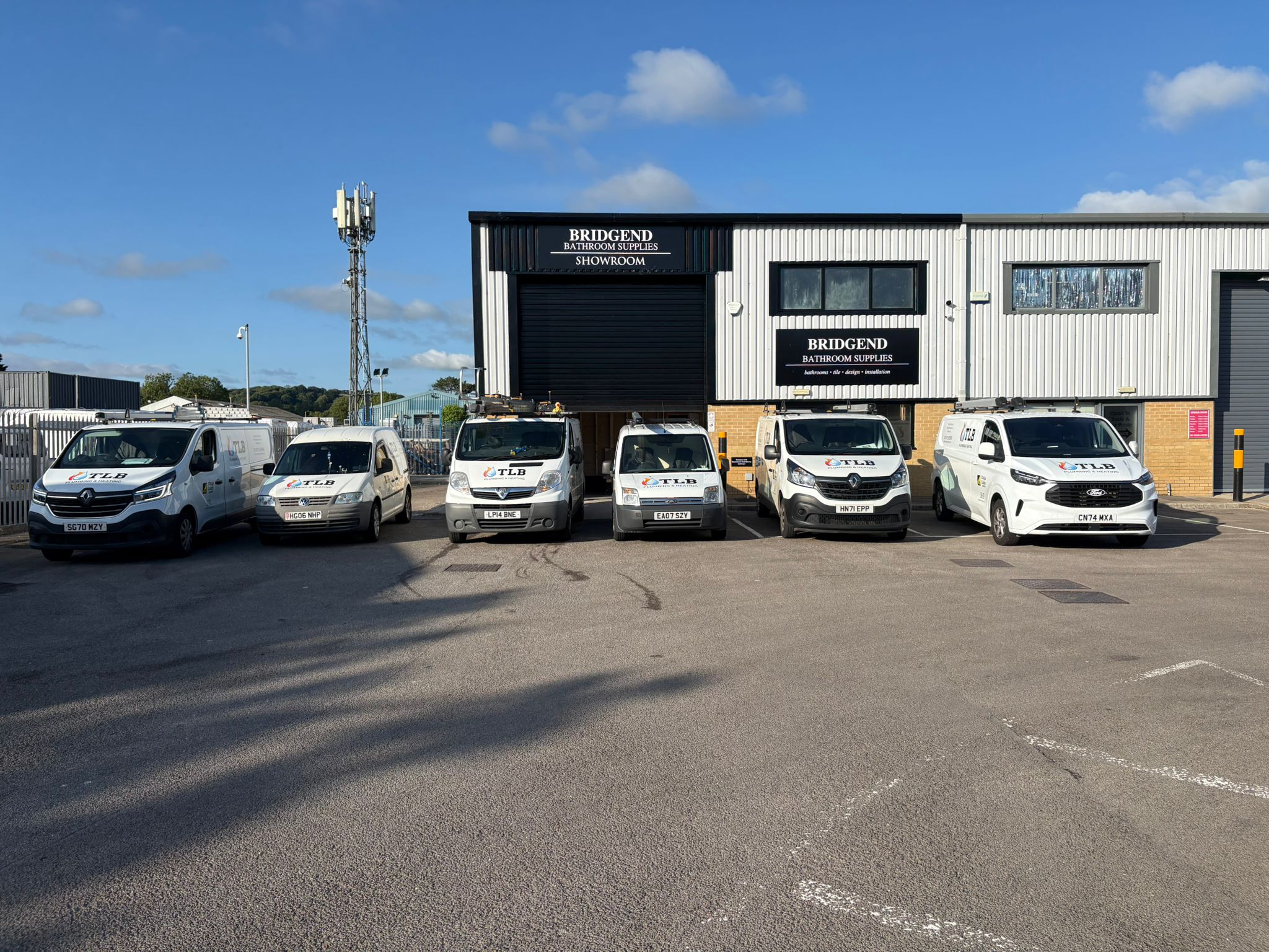 The TLB Plumbing & Heating fleet outside the Bridgend Bathroom Supplies showroom